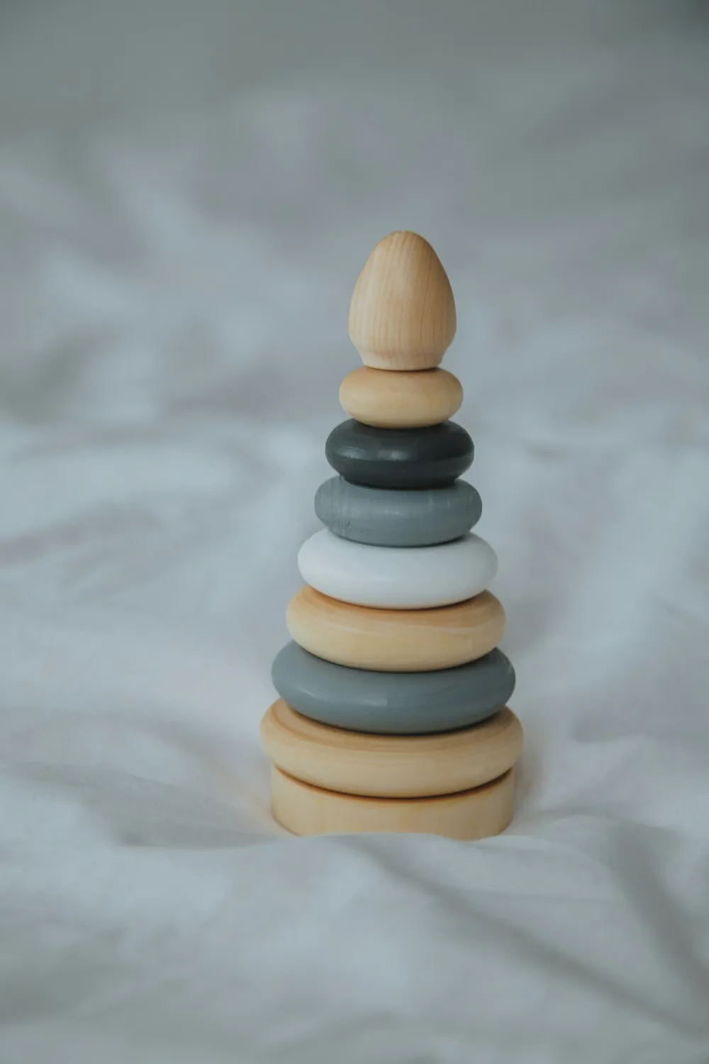 Photo of a similar item: Pearhead Wooden Rainbow Stacking Rings