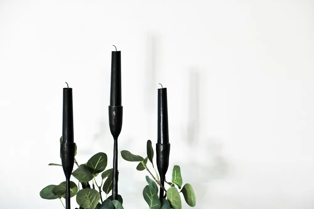 Photo of a similar item: CANDWAX Black Taper Candles, 12 in, 4 Pack